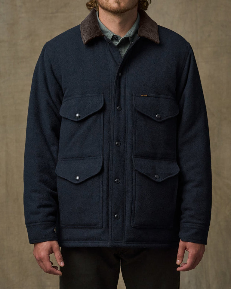 Filson Mens Spokane Cruiser Jacket in Navy is a full four pocket button down front with long sleeves and corduroy collar