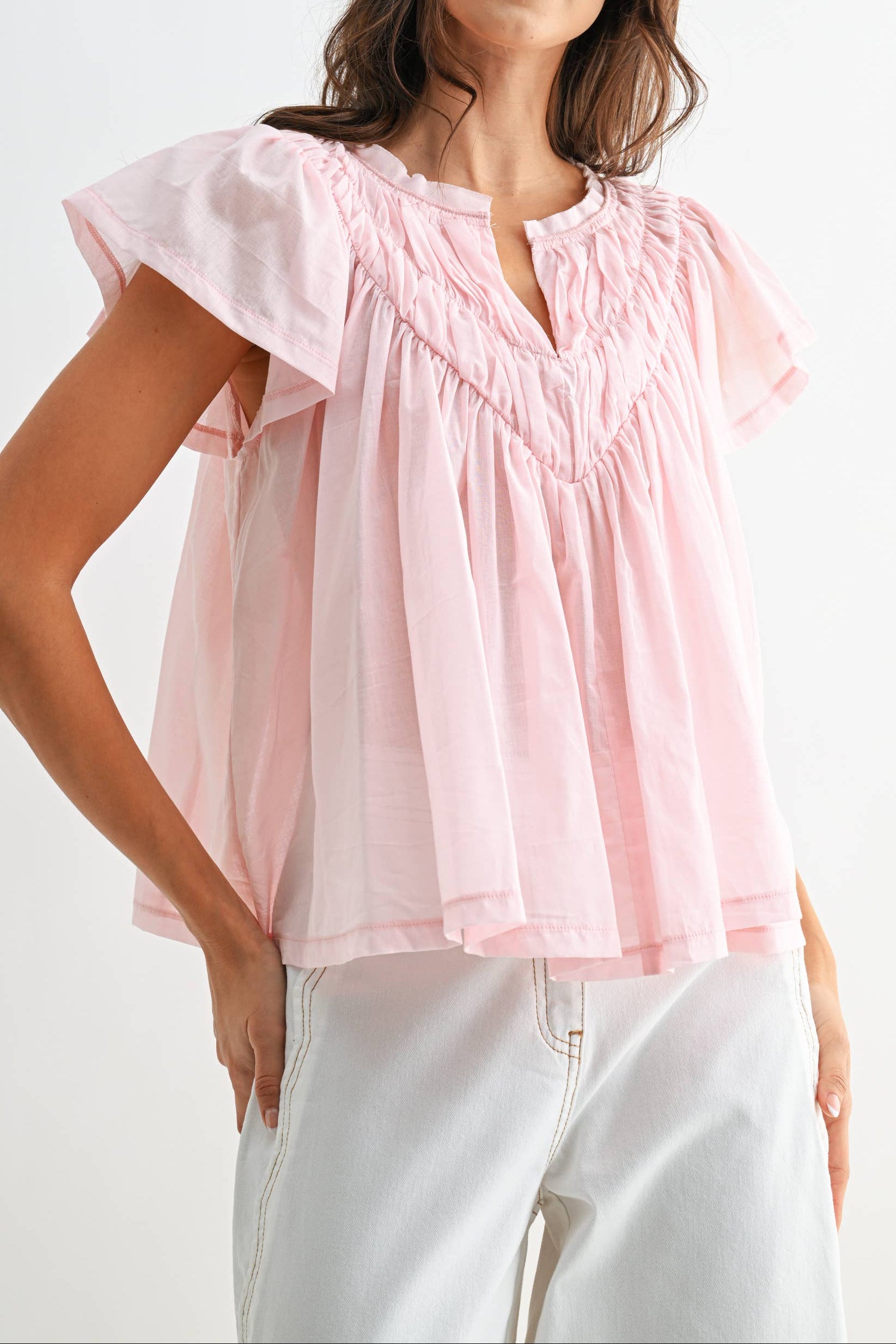 Flora Flutter Sleeve Gathered Neck Top in a v neck round top coming together in a light weight ruffle blouse at boltranchstore.com
