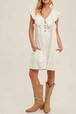 Franny Fringe Hem Shift Dress with a button up front, side pockets and raw hem, perfect for you favorite cowgirl boots at boltranchstore.com