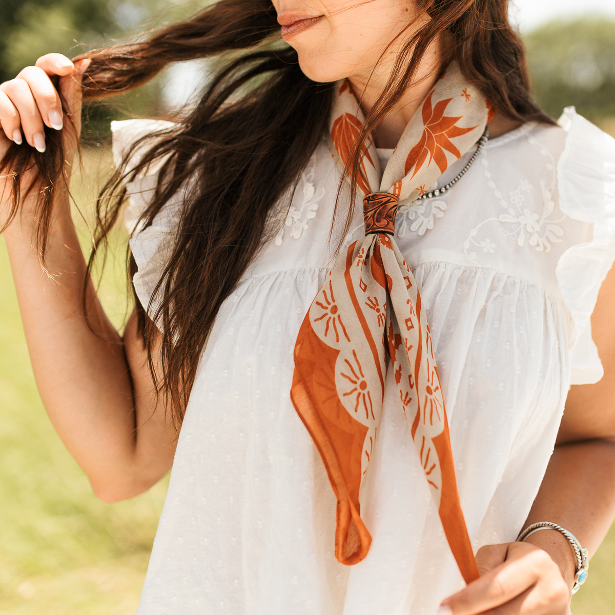 Fringe Scarves Game Day Down South Doily Bandana Orange scalloped border framing the western print with Fringe logo on center edge western fashion