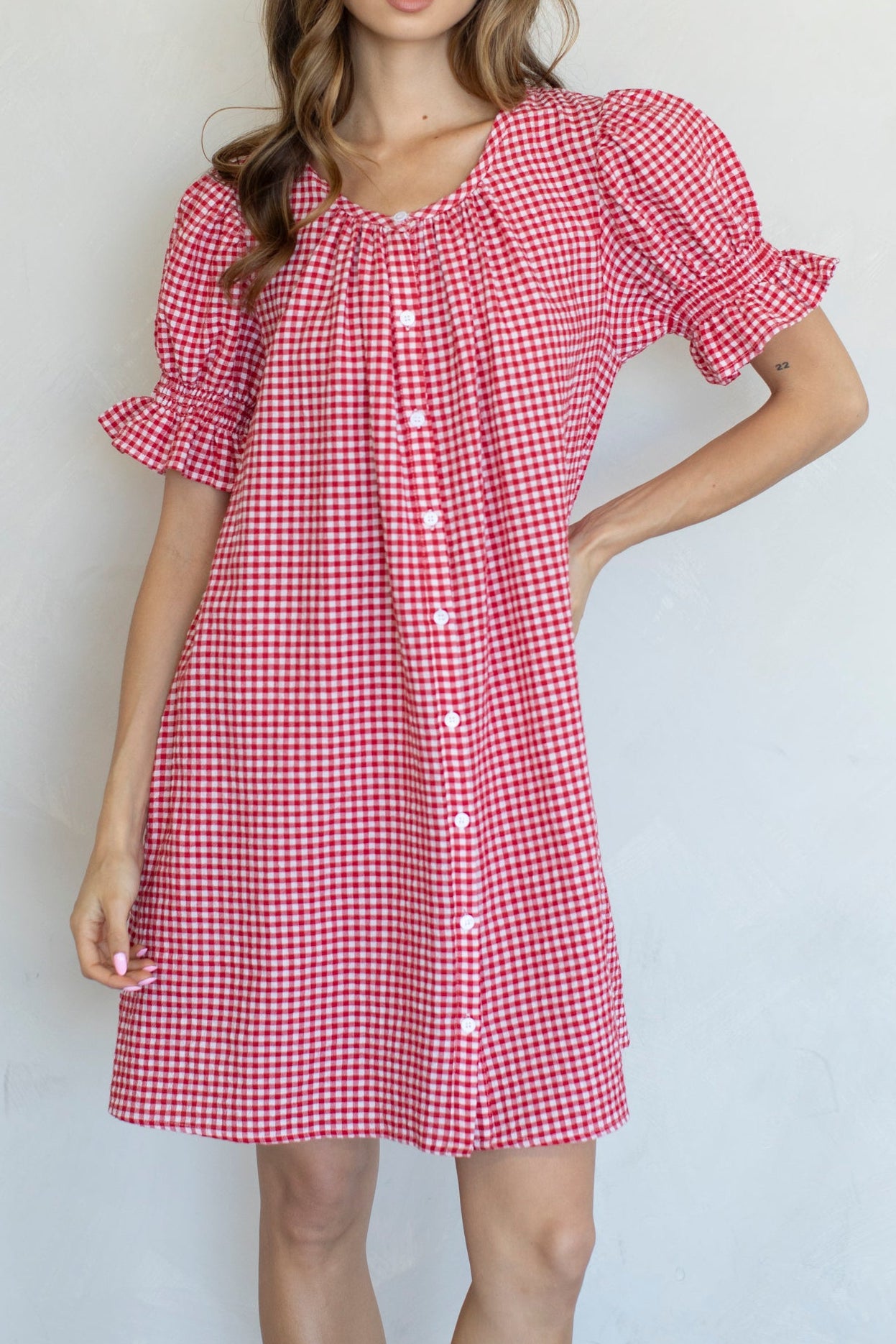 Grace Gingham Babydoll Dress features round neck button up front ruffle sleeves in a red or navy gingham babydoll dress at boltranchstore.com