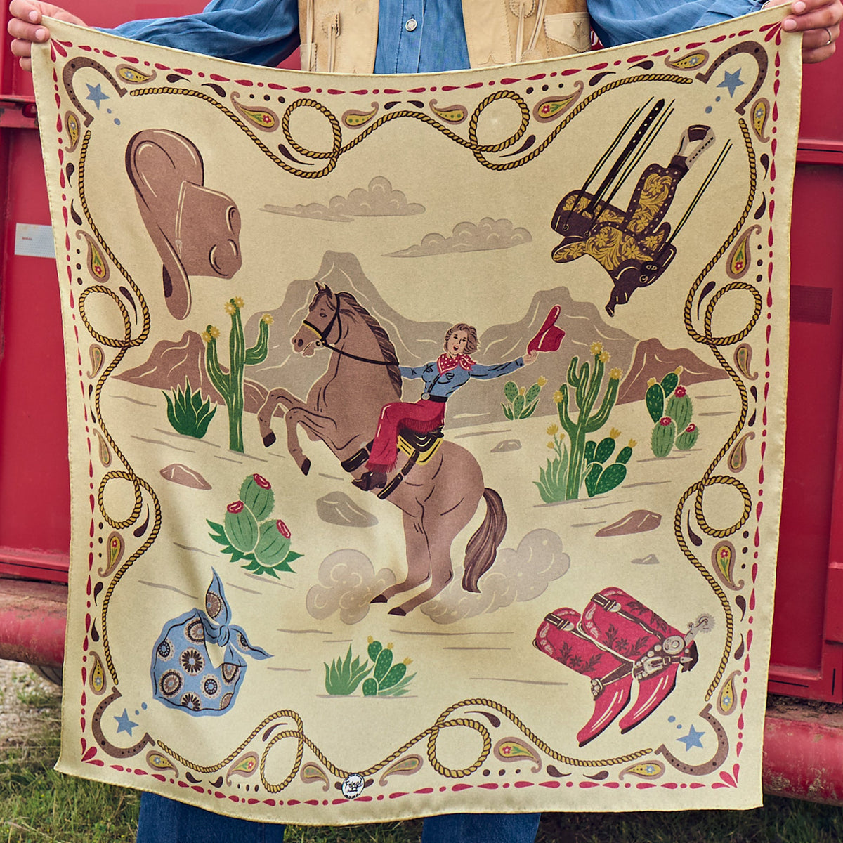 Fringe Happy Trails Silk Scarf Cream retro cowgirl on horseback with western gear in each corner on cream womens western boutique Utah SKU SCRFHPTLCRMSH26039