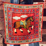 Fringe Head in the Clouds Silk Scarf prancing horse beneath soft clouds on a red ground with beadwork inspired borders womens western boutique Utah SKU SCRFHDCLREDLT26052