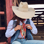 Fringe Head in the Clouds Silk Scarf ties in a bow for a softer look western clothing