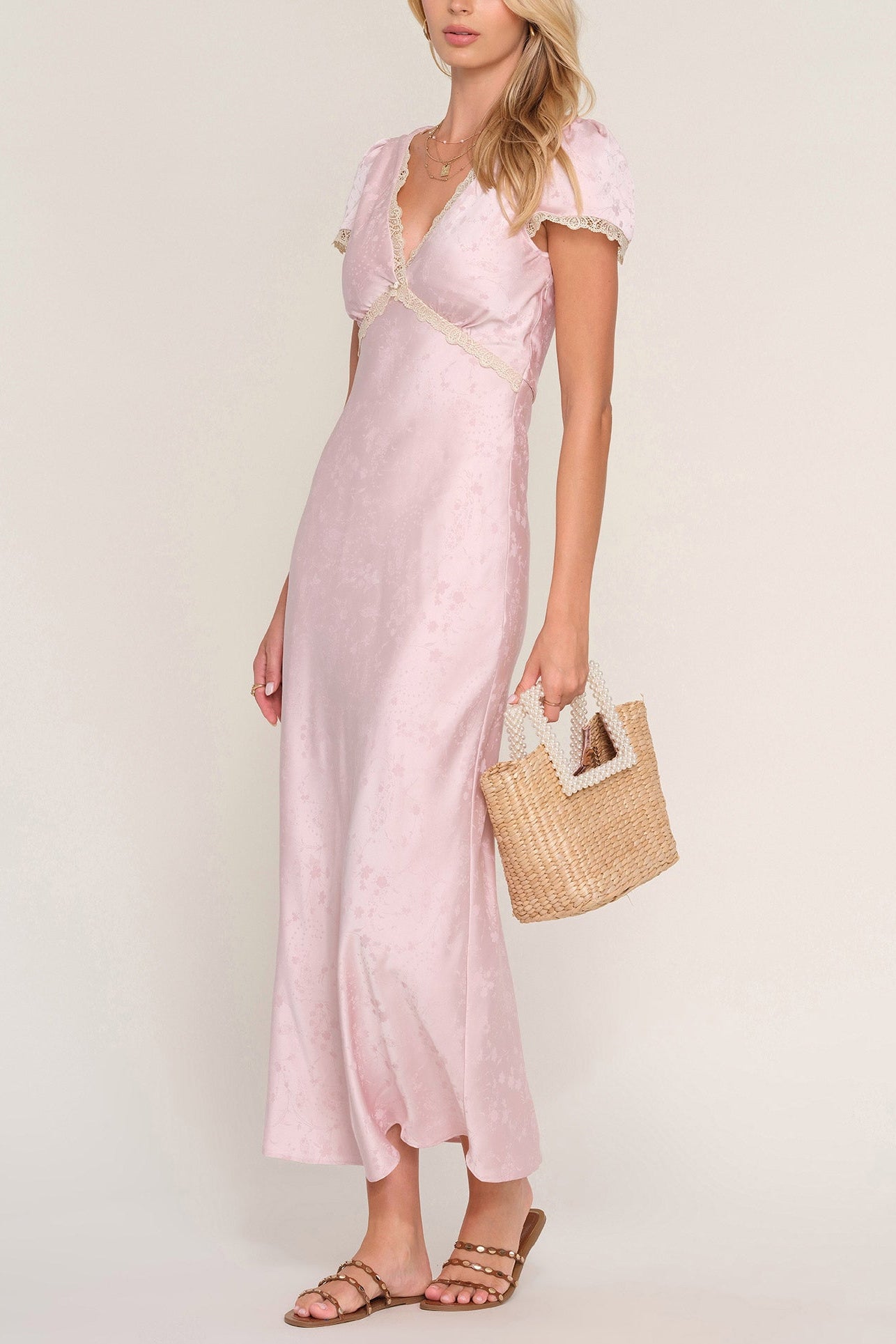 The Kerry Dress is made from a floral jacquard satin. It features a v-neck cap sleeve Heartloom pink wedding formal party dress Boltranchstore.com free shipping