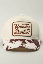 Howdy Darlin Cow Print Hat with cow print brim and a patch with Howdy Darlin on the patch at boltranchstore.com