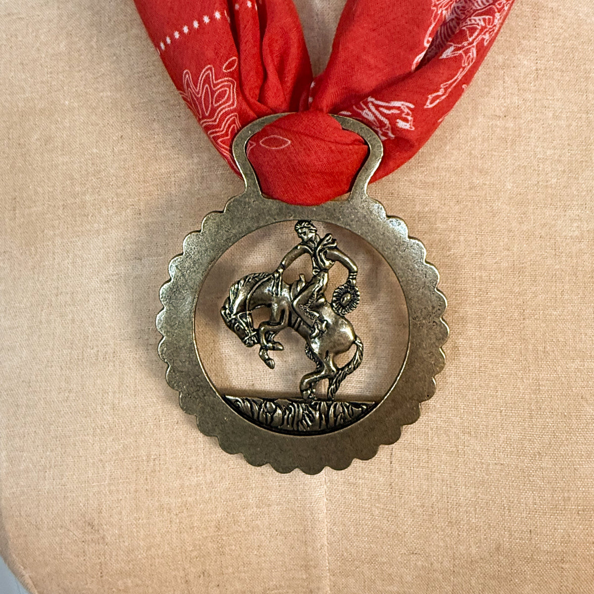 Fringe Slide Harnessed Bronc Rider holds a wild rag snug at the collar ranch wear