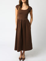 The Jane Midi Dress combines effortless style with practical comfort. Featuring short sleeves for easy movement and convenient pockets Boltranchstore.com free shipping