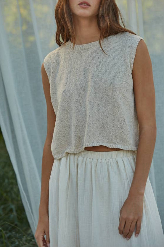 Karla Knit Sweater
A versatile womens sleeveless crop top with a classic crew neck. Perfect for layering or wearing solo, this knit sweater offers effortless style for any season.