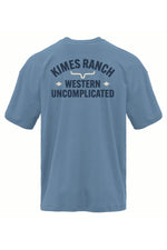 Kimes Mens Cavell T Shirt in Blue Jean a short sleeve t shirt with a front left print and the larger Kimes Ranch Western Uncomplicated logo printed on the back at boltranchstore.com 