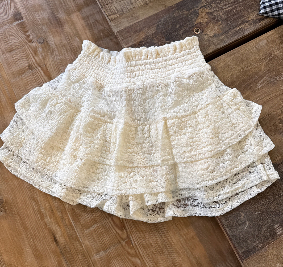 Kitty Girls Lace Smocked Waist Shorts An off-white lace tiered mini skirt with a smocked elastic waistband bolt ranch store girls western apparel 