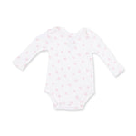 A white long-sleeve baby bodysuit with a delicate pink horseshoe pattern, displayed flat against a clean white background. Little Horseshoes Pink Long Sleeve Bodysuit Shop today at boltranchatore.com