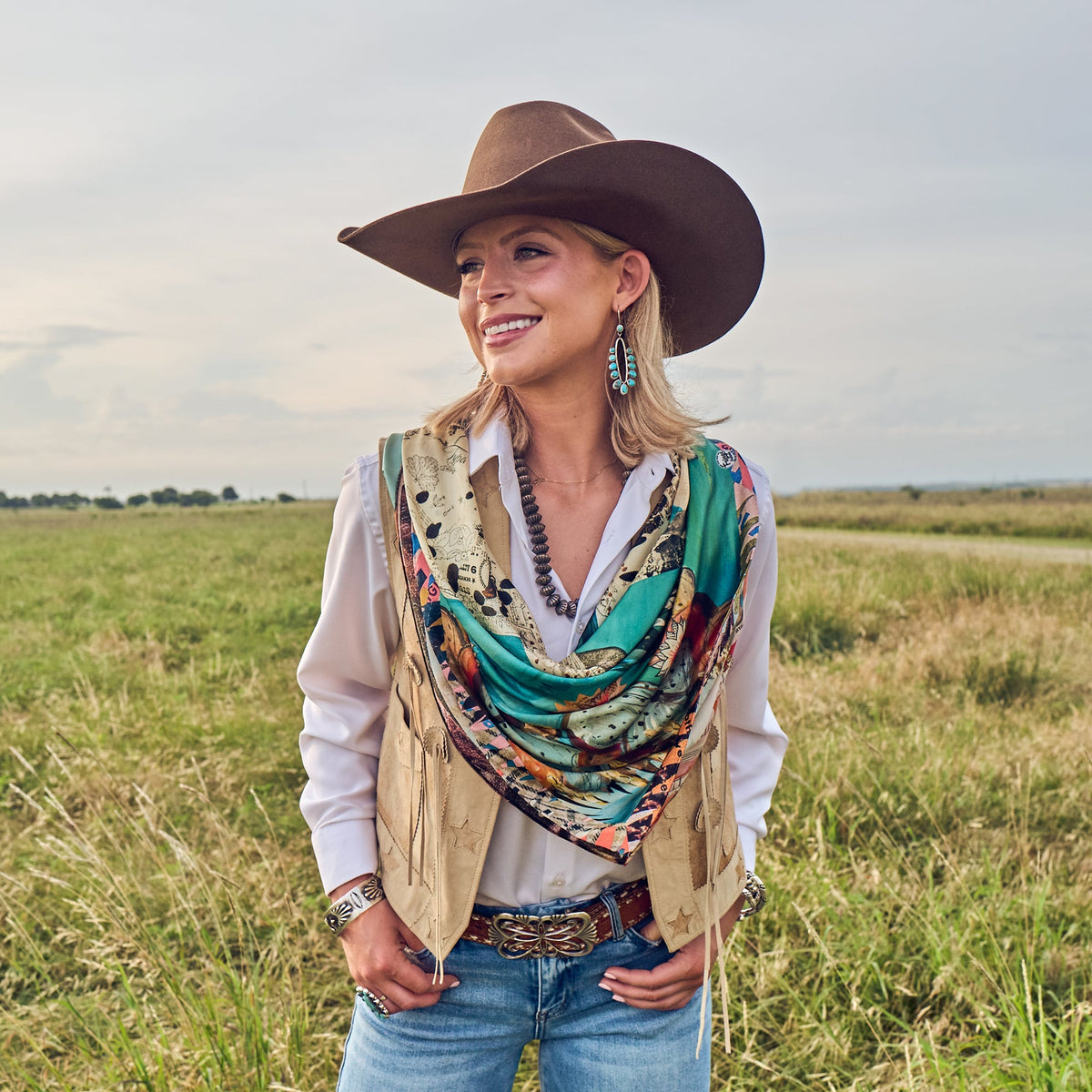 Fringe Shades of Texas Silk Scarf ties in a bow for a softer look western clothing