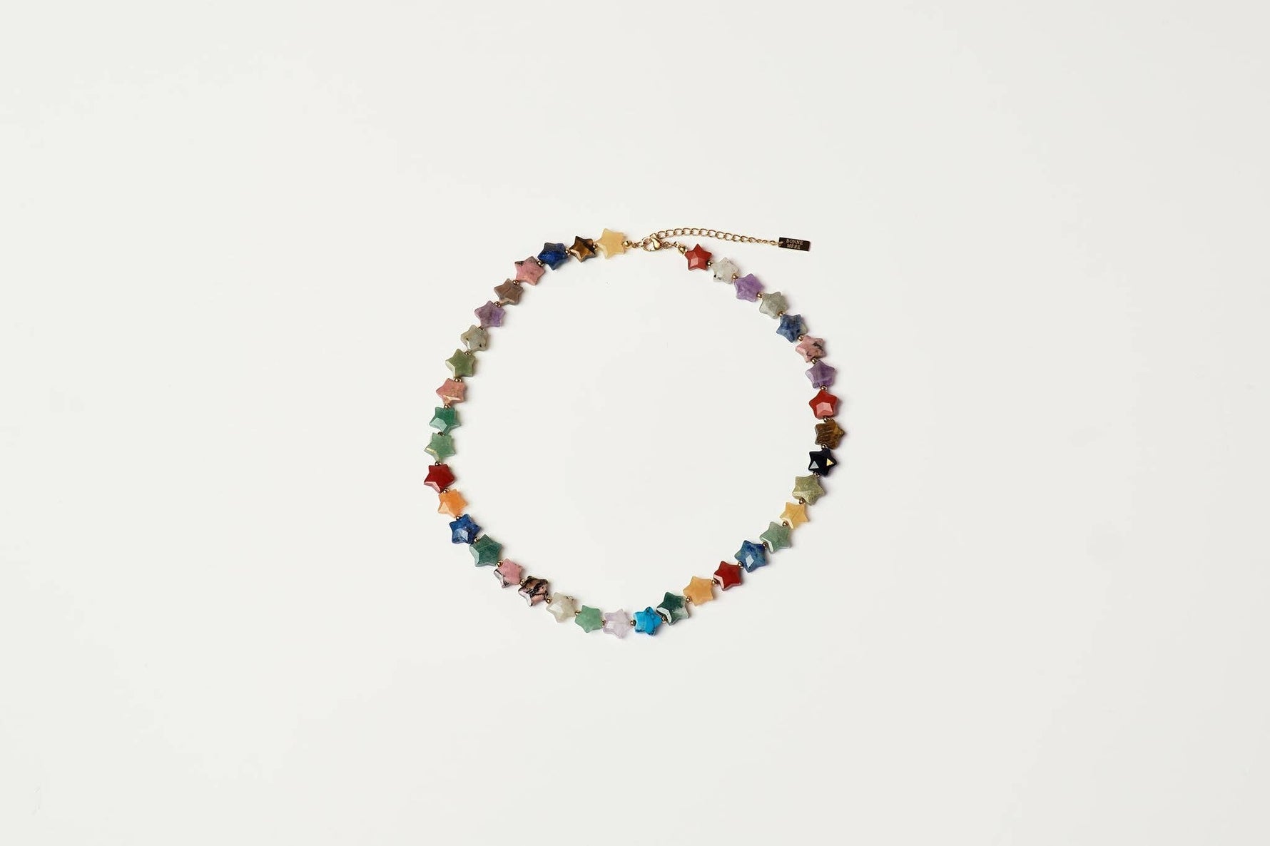 shop at boltranchstore.com beaded necklace made of small star-shaped beads in multiple colors, arranged in a circle on a plain white background. free shipping