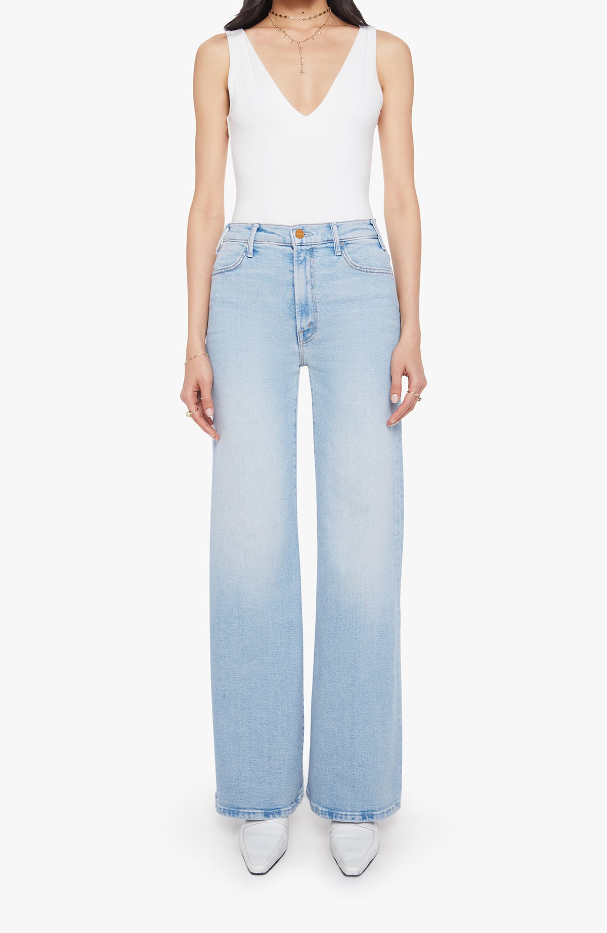 Mother The Hustler Roller Sneak Complete 360 These light-wash jeans feature a clean, modern silhouette with a flattering high-rise waist and a relaxed wide-leg fit. Designed to elongate the leg, they fall straight from the hip with an easy drape and finished hem. Classic five-pocket styling is complemented by subtle back-pocket stitching for a refined touch. Versatile and effortless, this pair pairs perfectly with fitted tanks, bodysuits, or cozy knits for everyday wear.