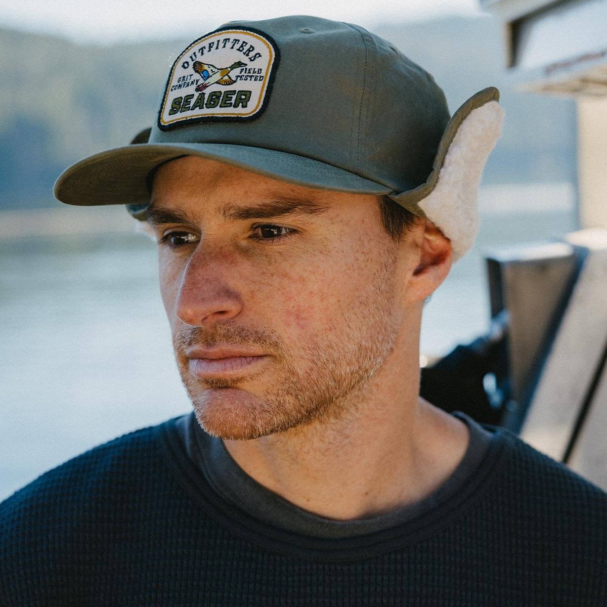 Seager Outfitters Waxed Flapjack Green winter cap worn on cold ranch mornings cowboy