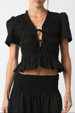 Pamela Ruffled Top a tie front peplum with a bottom ruffle and smocked shirt with quarter sleeves at boltranchstore.com