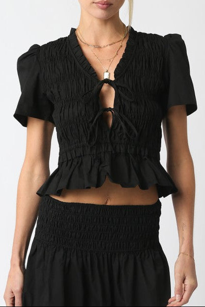 Pamela Ruffled Top a tie front peplum with a bottom ruffle and smocked shirt with quarter sleeves at boltranchstore.com