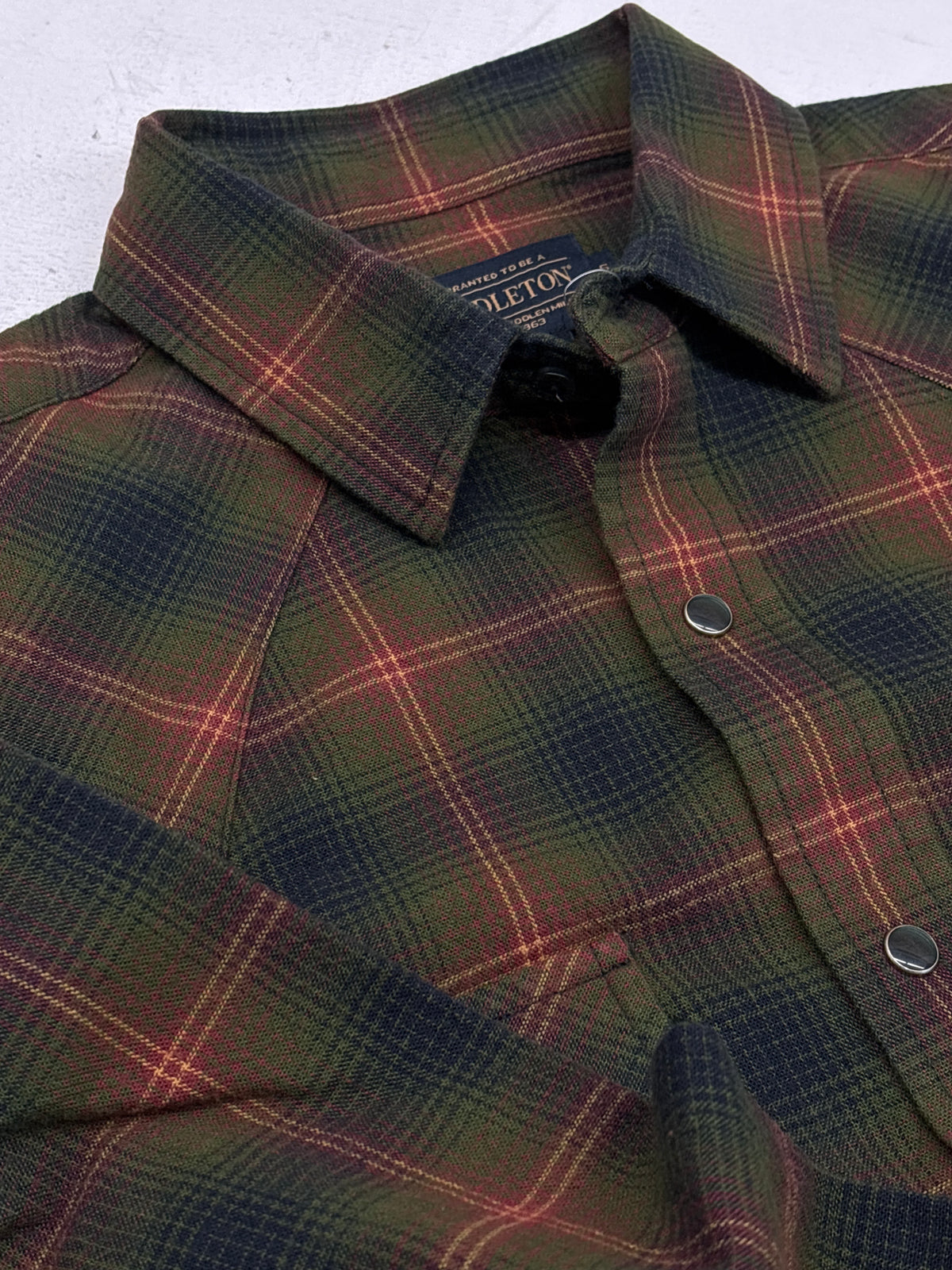 Pendleton Mens Wyatt Shirt flannel in green navy plaid and pearl snap button down closeup