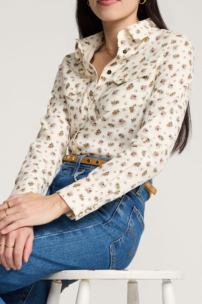 Woman wearing a Pendleton floral Cotton twill gambler blouse and blue jeans available at boltranchstore.com