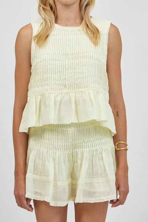 Phoebe Linen Pin Tuck Sleeveless Top with a bottom ruffle and lace sleeves at boltranchstore.com