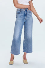 Person wearing light blue wide-leg jeans  Pistola Lana Crop in Bistro at boltranchstore.com  free shipping womens jeans crop mid was in stock 