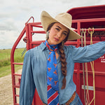 Fringe Scarves Boli Preppy Saddle Red Blue wrapped around a cowboy hat as a hatband Park City