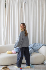 Things Between Juniper Cardigan cozy fall and winter layering piece styled with dark wide leg pants cowgirl Park City