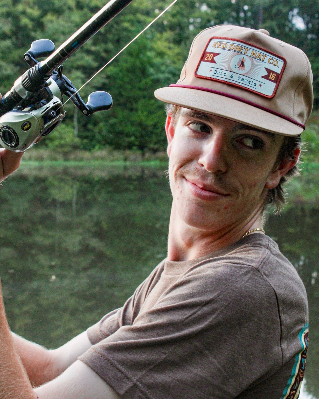 Red Dirt Hat Co  Catch and Release Tan  Tan with maroon rope unstructured 5 panel flat bill style snapback cap featuring the “Catch & Release” patch available at boltranchstore.com