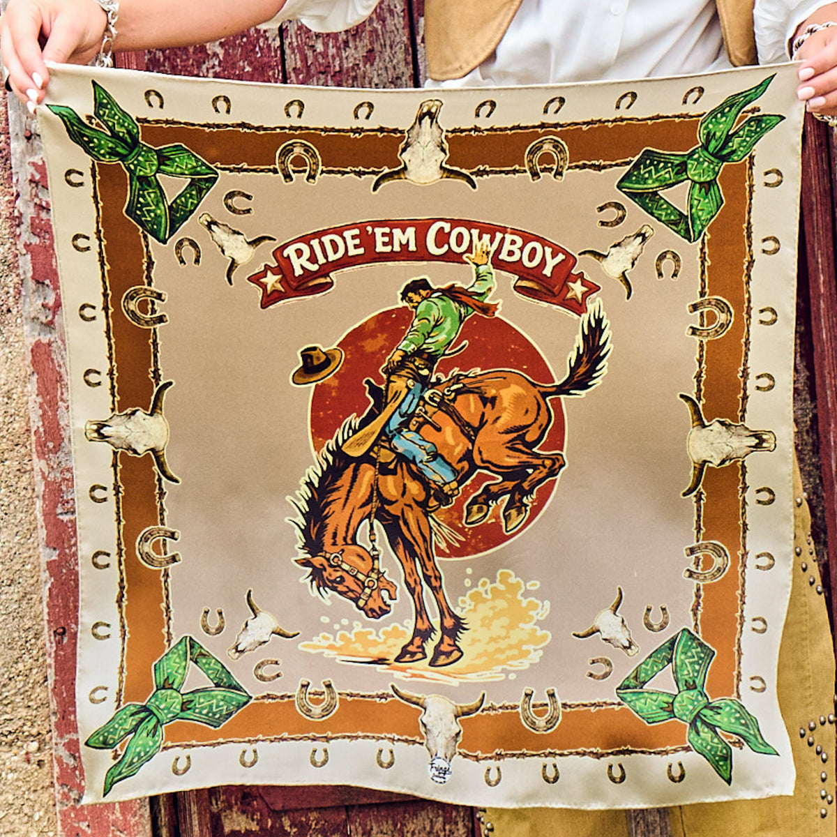 Fringe Ride Em Cowboy Silk Scarf Brown bucking horse framed by vintage western icons in tan and brown womens western boutique Utah SKU SCRFRECBRNSH26088