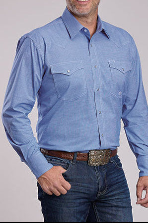 Man wearing a blue shirt, jeans, and a beige cowboy hat on a gray background
shop at boltanchstore.com