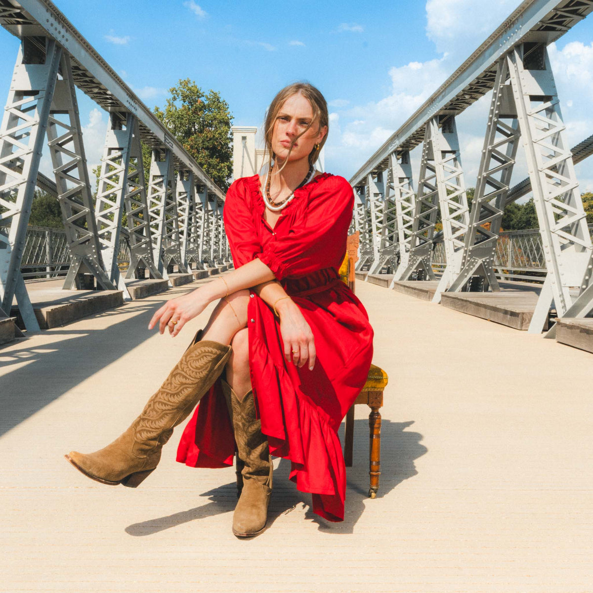 Sendero Haven Dress Crimson flowy midi length with a tiered ruffle hem and button front cowgirl