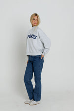 Sunny Somewhere Navy Sports Mockneck ribbed cuffs and banded hem on an easy pull on top built for layering ranch wear Kamas
