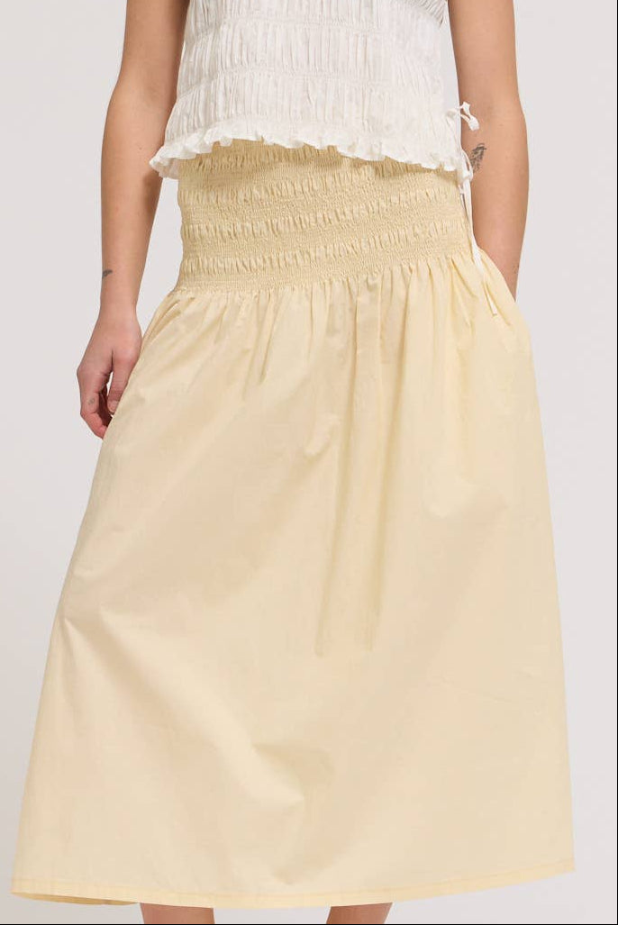 Sally Smocking Waist Skirt in a smocking waist in a midi skirt in a light yellow at boltranchstore.com