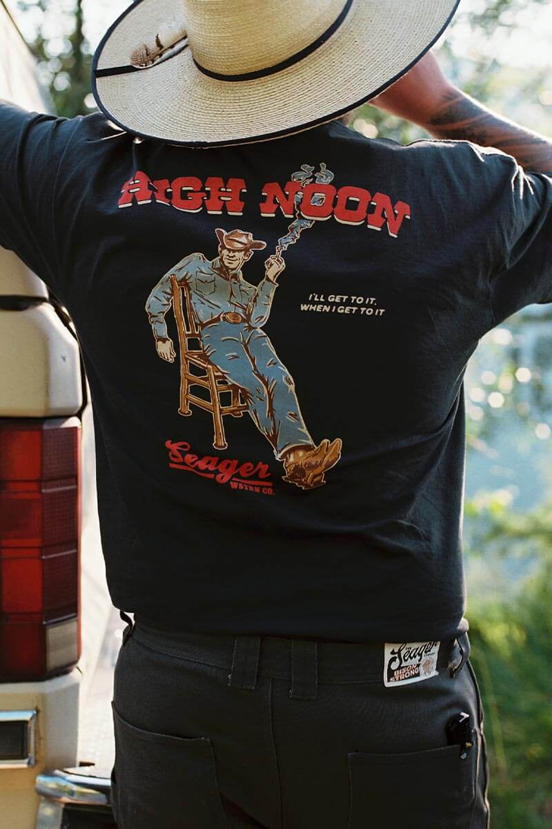 Seager High Noon Tee featuring the high noon with a cowboy in a chair relaxing the day and a shirt available at boltranchstore.com