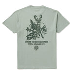 Seager Mens Division Premium Tee Pigment Moss at boltranchstore.com with free shipping in stock A sage green short-sleeve t-shirt shown from the back, featuring a dark green graphic of a deer on branches with the text 'SEAGER OUTDOOR EQUIPAGE FISH & WILDLIFE DIV' and a circular logo below.
