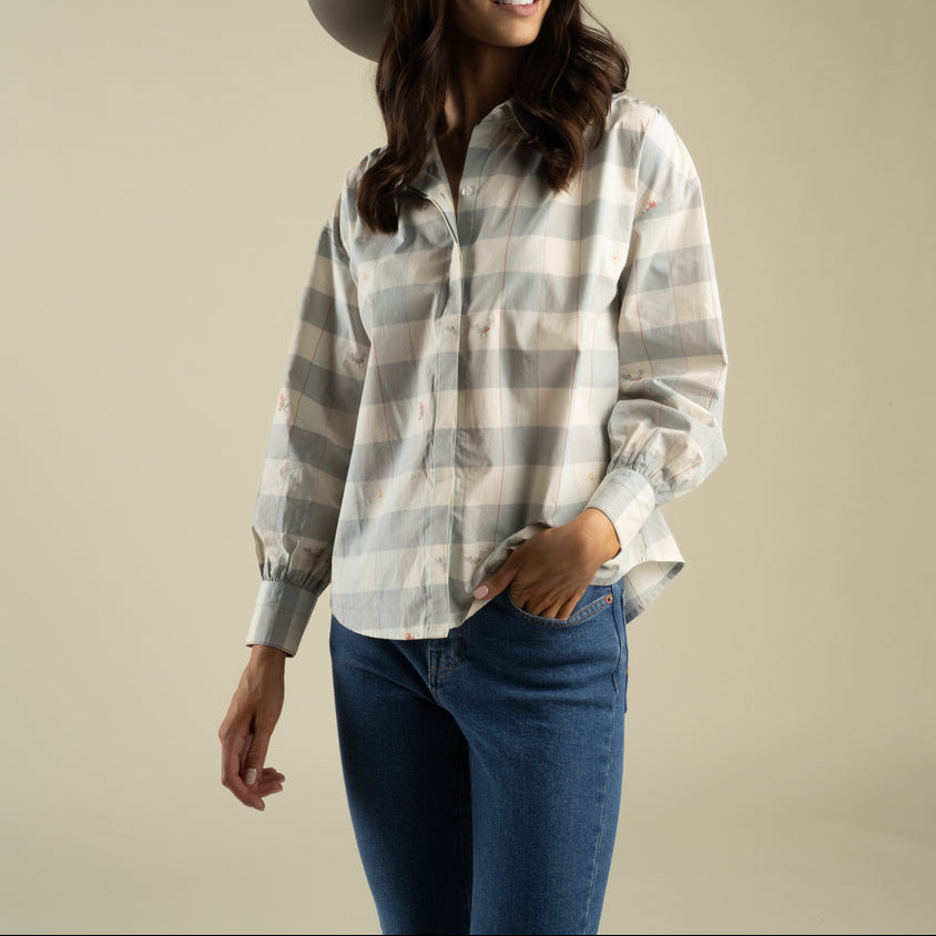 Sendero Womens Helena Button Down at boltranchstore.com in stock free shipping A woman modeling a light gray and white striped long-sleeve button-up shirt  womens button down with flowers 