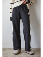 Sporty Cotton Drawstring Pants with a cream side contrast in both navy or black at boltranchstore.com