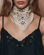 The Great Silk Bandana Cream airy silk neckerchief knotted at the neck for western fashion