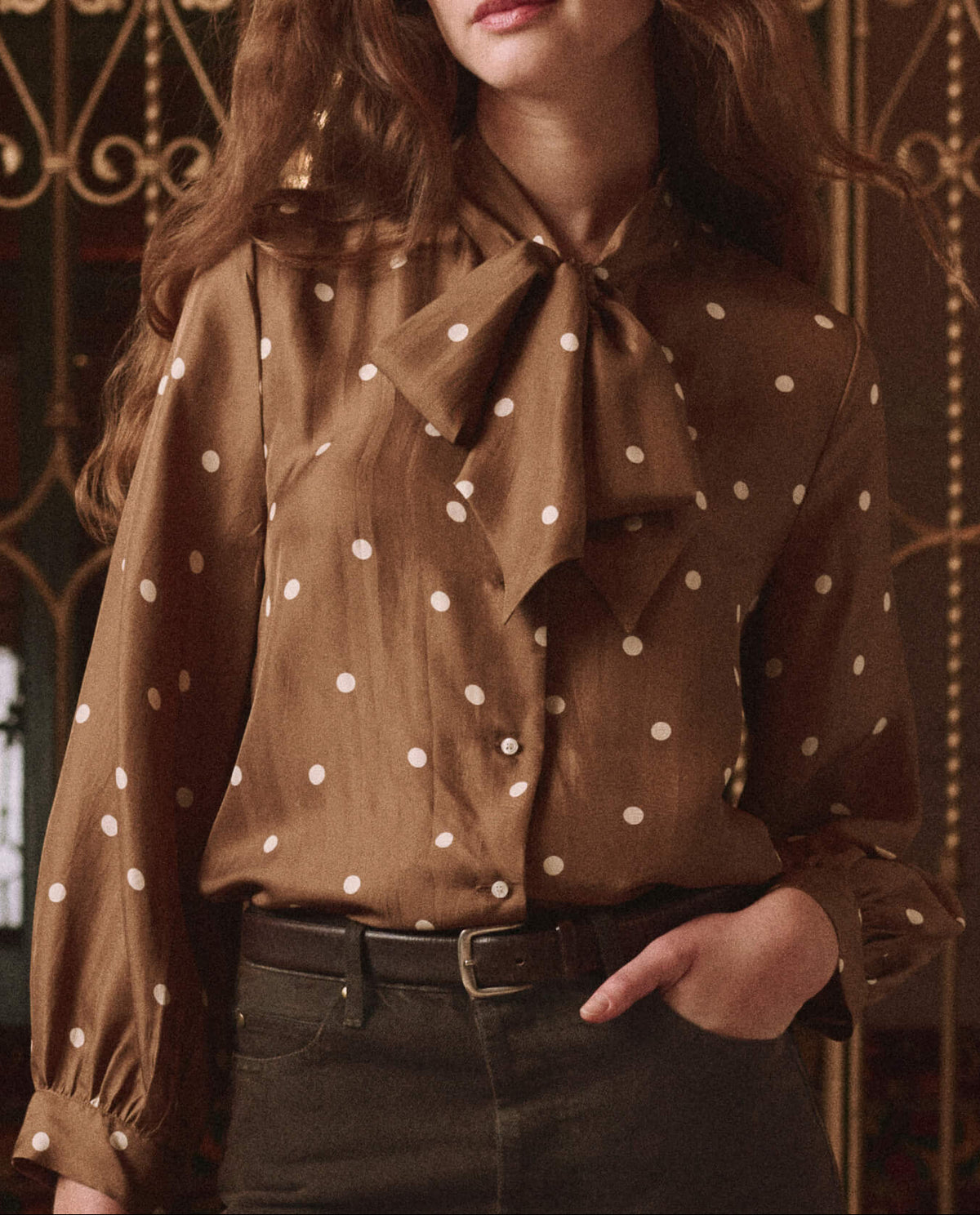 The Great Zenith Top Copper Bubble Dot tie neck bow at the collar with button front