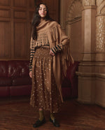 The Great Big Sweater Fringe Scarf Camel paired with a striped crew and copper dot skirt ranch wear