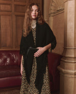The Great Big Sweater Fringe Scarf Black styled over a leopard dress for cold weather ranch wear