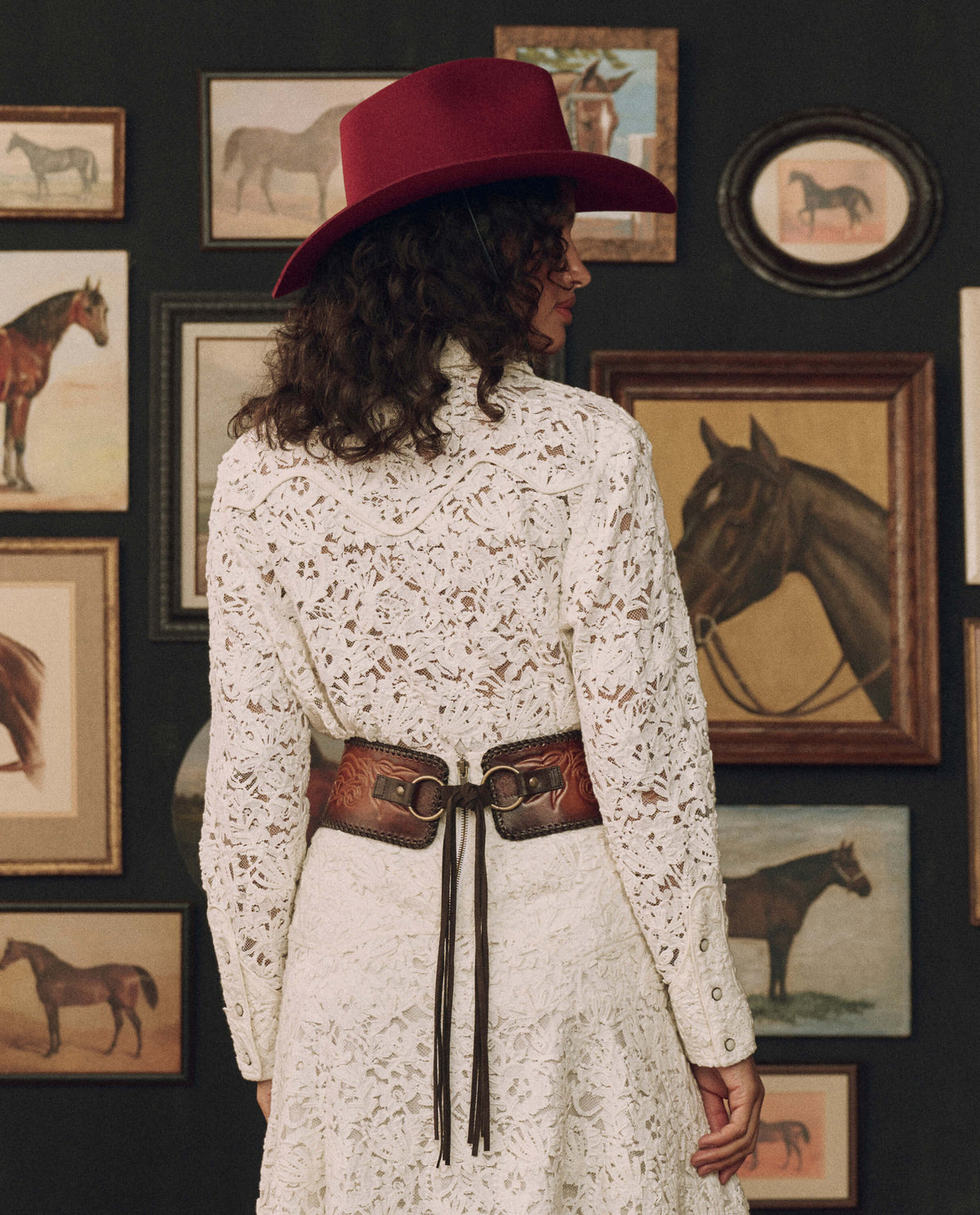 Stetson x THE GREAT Tooled Corset Belt Burnished Brown styled with a red felt hat and cream lace western fashion Kamas Utah