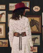 Stetson x THE GREAT Tooled Corset Belt Burnished Brown styled with a red felt hat and cream lace western fashion Kamas Utah