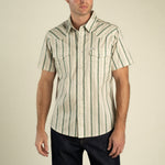 The Wyatt Pearl Snap Print Shirt at boltranchstore.com in stock free shipping A man wearing a short-sleeve western-style button-up shirt with vertical green and beige stripes, 