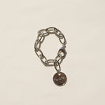 Twisted Silver Classic Bracelet at boltranchstore.com free shipping in stock A silver chain bracelet with a small round metal charm engraved with the word 'TWISTED', 