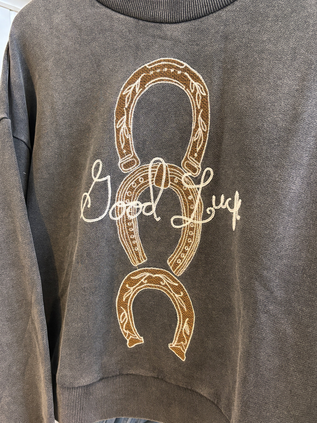 Womens Western Horseshoe Crewneck by Blue B sold at Bolt Ranch Store gray acid wash sweatshirt with embroidered horseshoes and good luck