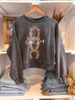 Western Horseshoe Sweatshirt with embroidered brown horseshoes and the words Good Luck is a perfect western fashion statement for women sold near me at Bolt Ranch Store Kamas Utah