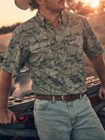 Wrangler Mens All Terrain Performance Snap Shirt a short sleeve shirt with pearl snaps with a southwestern print cactus buffalo collared shirt a perfect ranch shirt at boltranchstore.com
