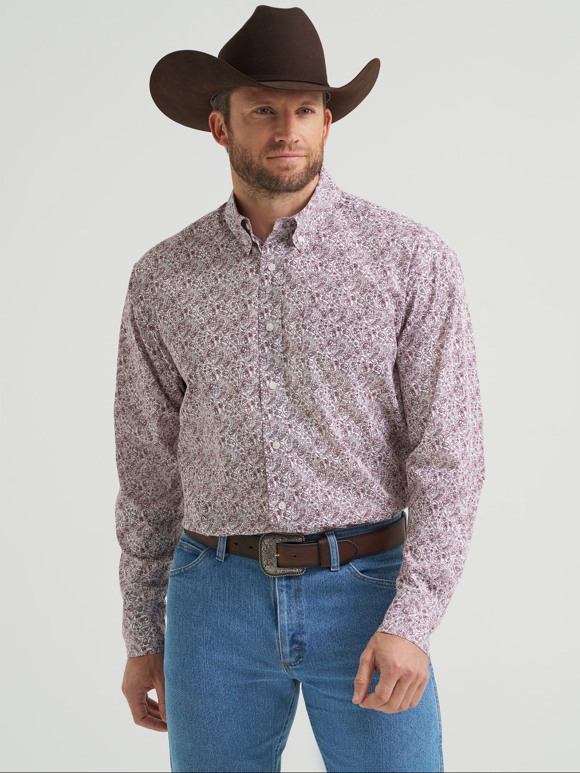 Wrangler Men’s Classic Button Down Shirt featuring a traditional western design with a pointed collar, front chest pockets, and pearl snap buttons in a burgandy paisley print with long sleeves  at boltranchstore.com